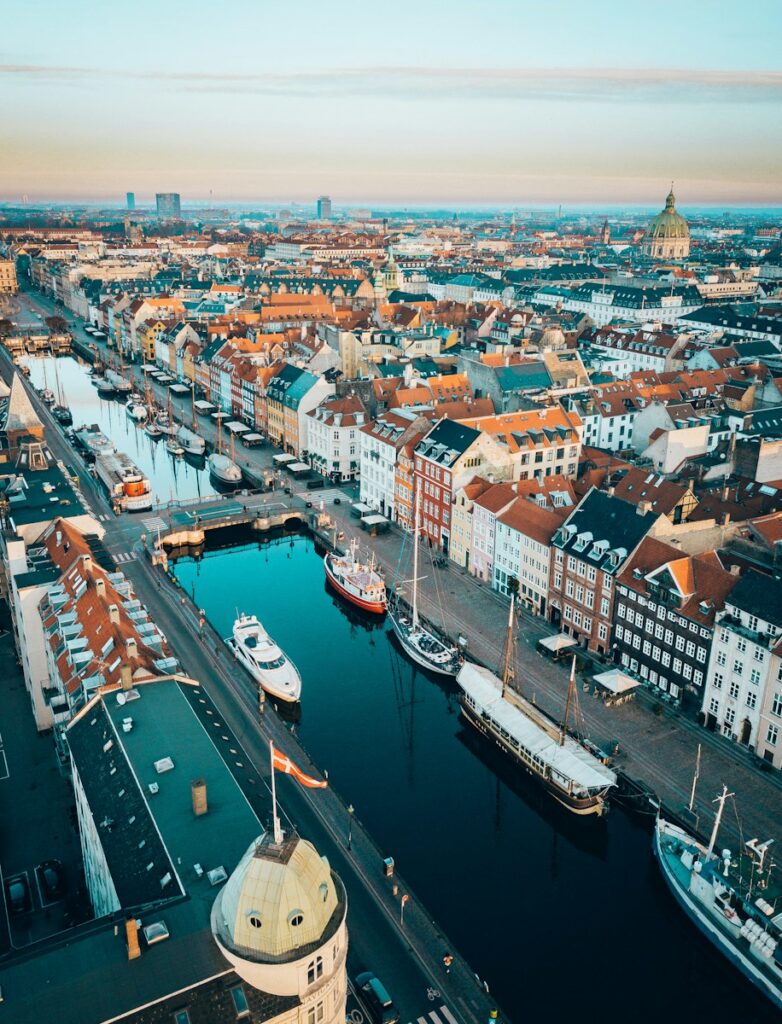 Copenhagen's picturesque Nyhavn harbor with its colorful facades is a must-visit destination after moving to Copenhagen