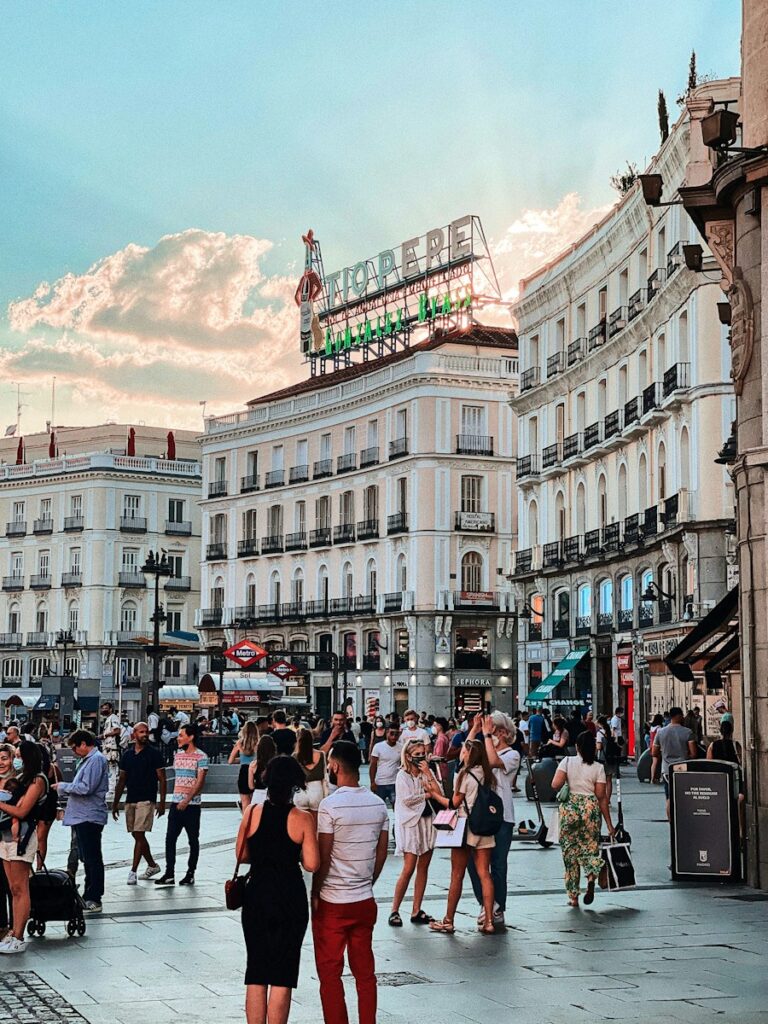 Locals walking around the vibrant streets of Madrid during daytime
