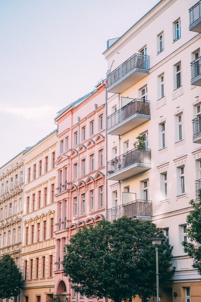 Charming residential street in Prenzlauer Berg, lined with colorful buildings and bustling with local life – a perfect representation of Berlin's nicest areas to live